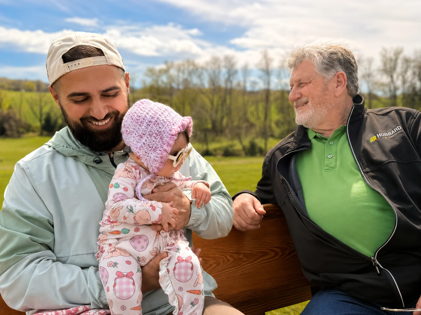 Phil Liskey with his son-in-law and granddaughter on the family farm